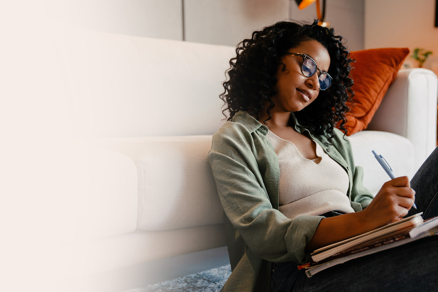 Black woman writing in a journal ready of individual and couples therapy in California, Oregon and Washington